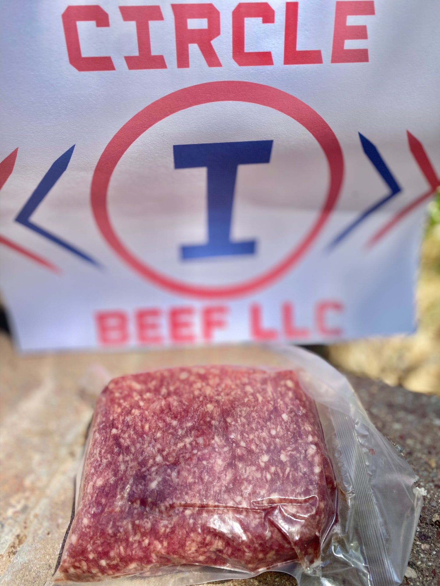 Packaged beef in front of a Circle I Beef LLC sign
