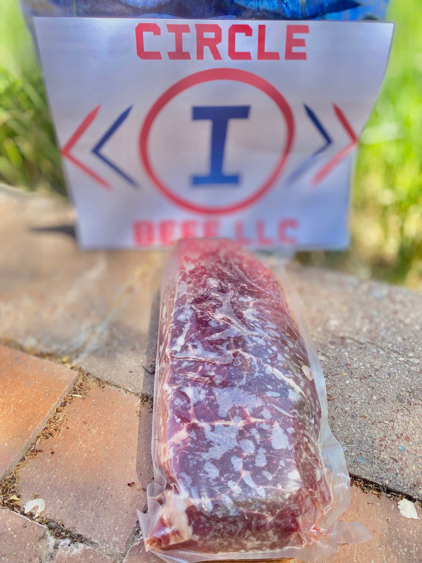 Packaged meat product with a 'Circle I' branded sign in the background.