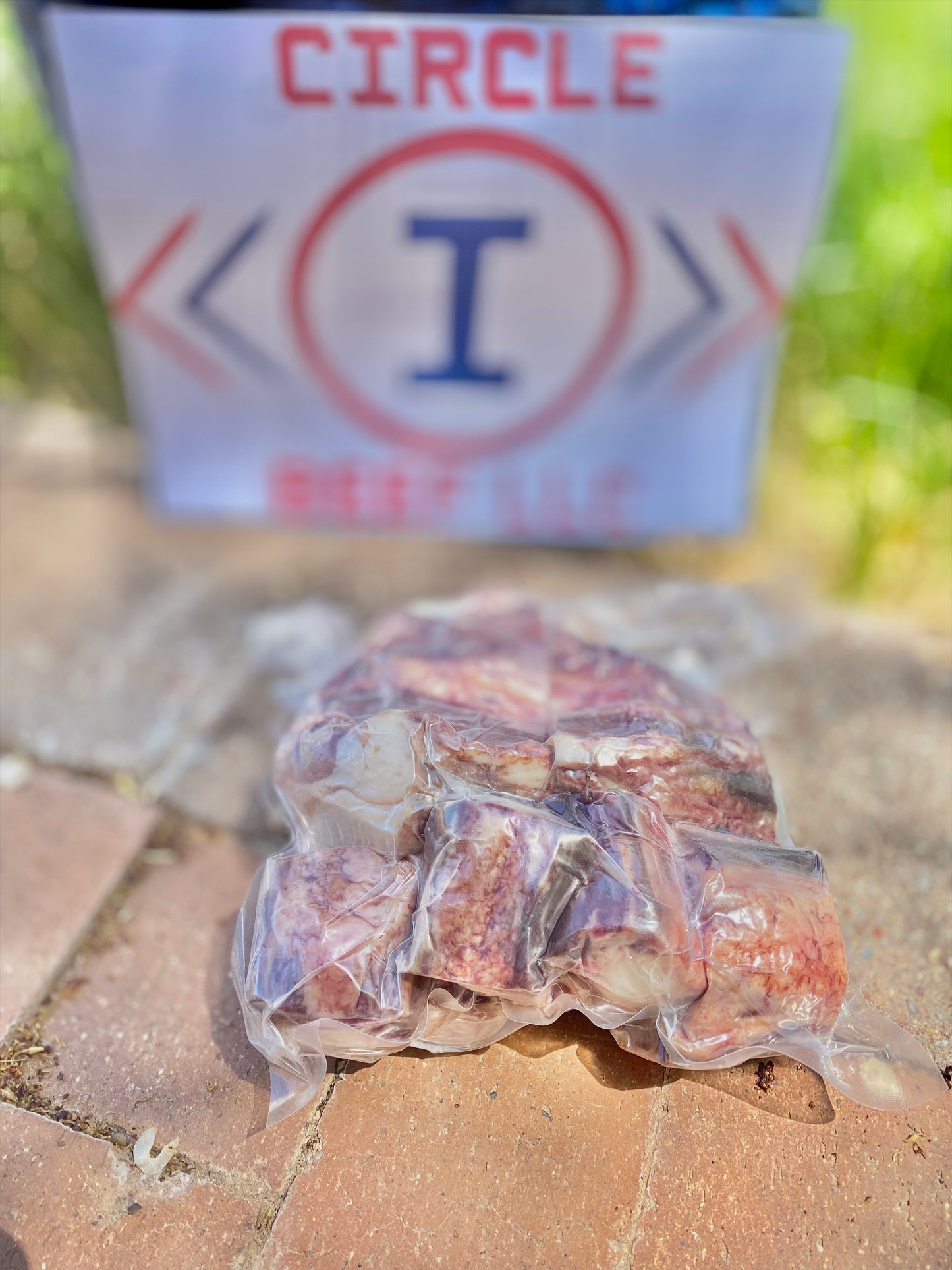 Packaged meat product on a concrete surface with 'Circle I' branding in the background.
