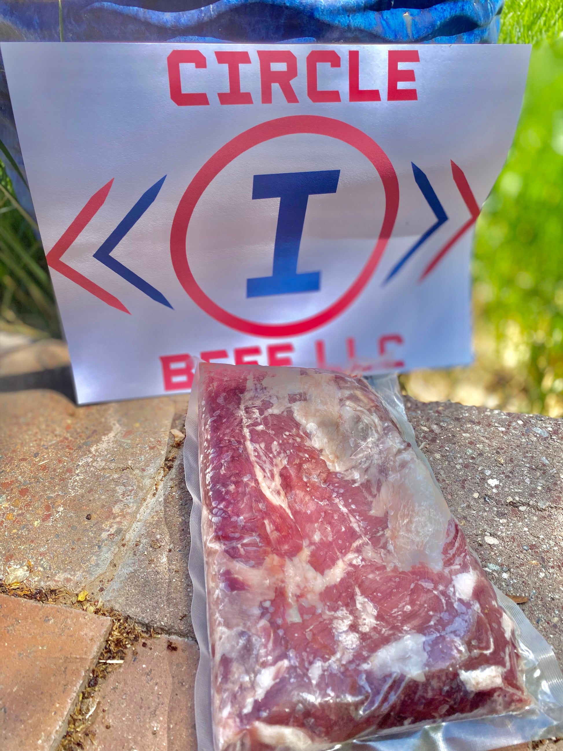 Packaged meat in front of a 'Circle I' sign