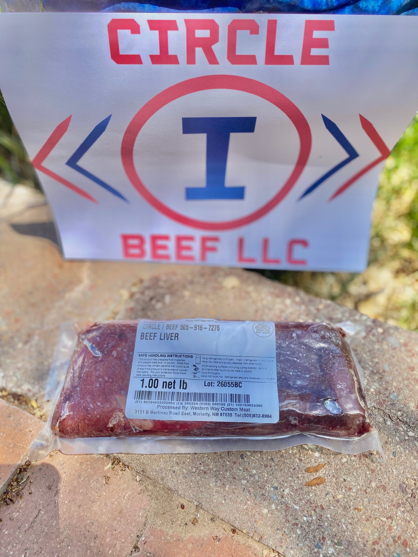 Packaged beef liver with Circle I Beef LLC logo in the background