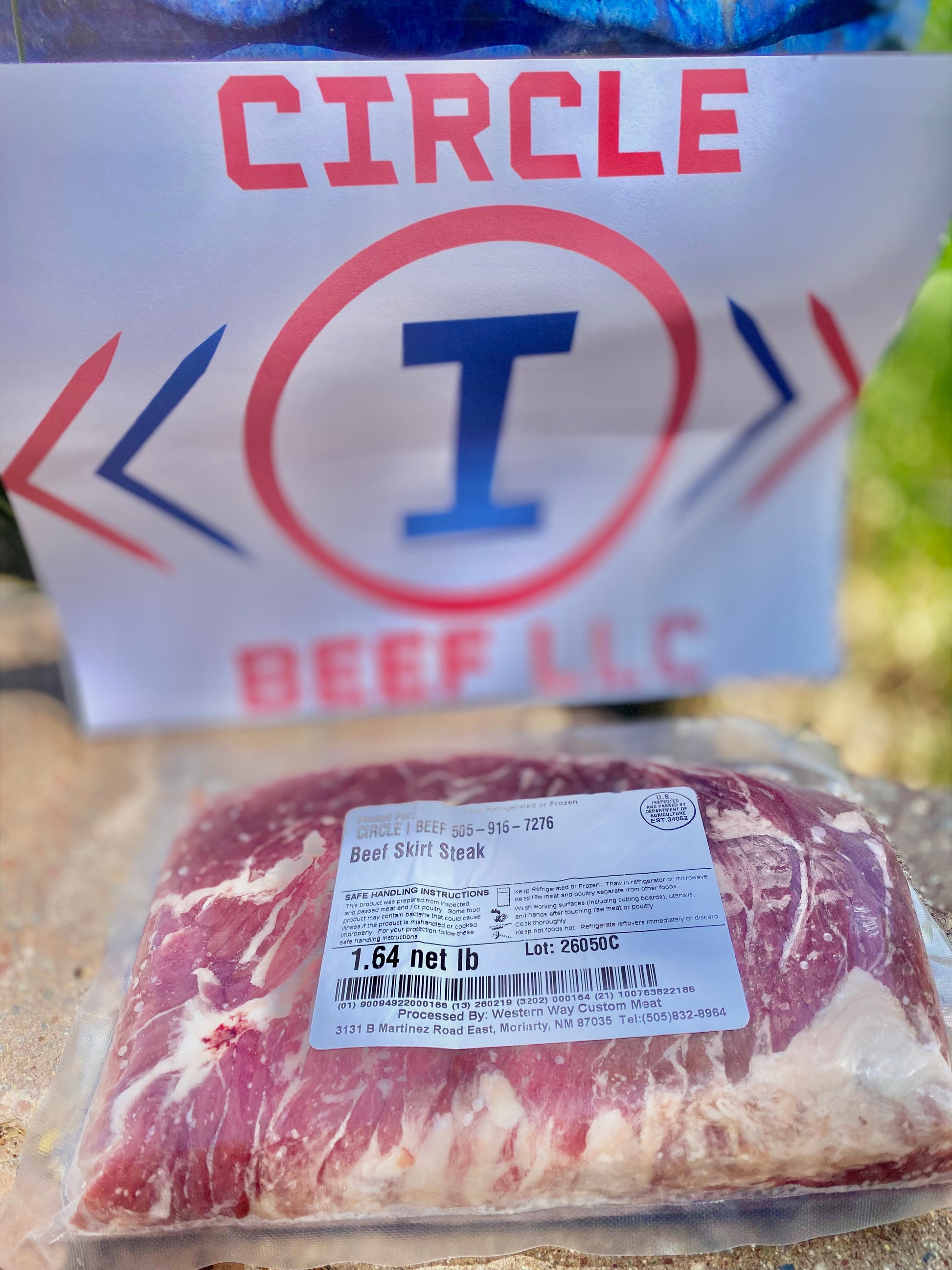 Packaged beef with Circle I Beef LLC logo in the background