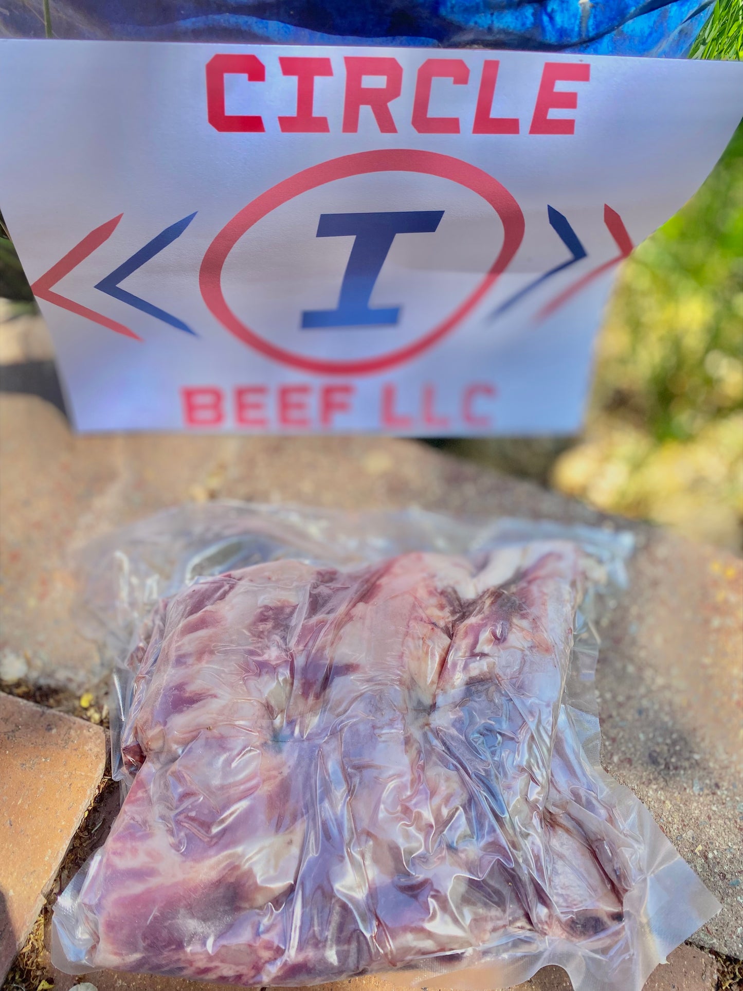 Packaged beef with a 'Circle I Beef LLC' sign in the background