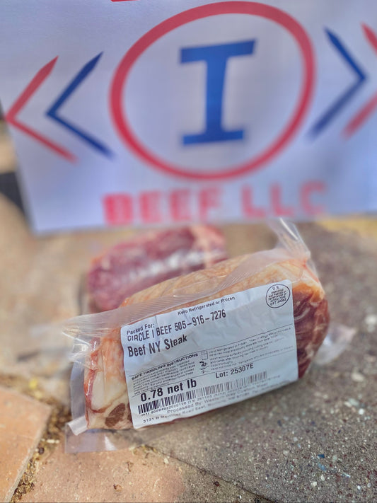 Packaged beef with a 'Circle I Beef LLC' sign in the background.